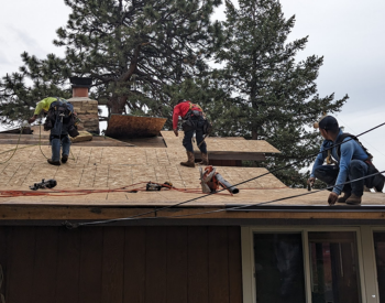 Roofers installing new sheathing and underlayment on a residential roof in Aptos, ensuring weatherproof and secure roofing.
